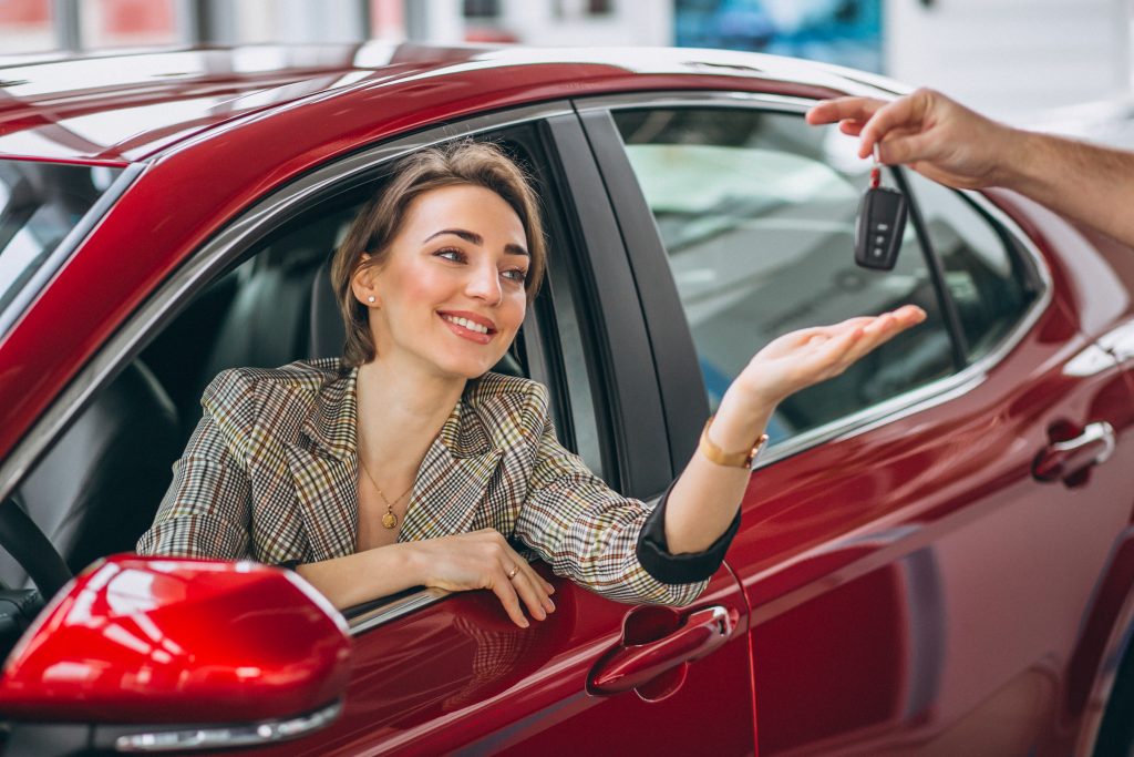 Persian Horizon woman sitting red car receiving keys 1