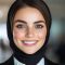 Confident young woman in professional attire smiling